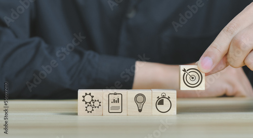 business strategy, Action plan, Goal and target, hand stack woods block step on table with icon about business strategy and Action plan. business development concept. copy space
