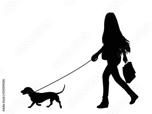 woman walking a dog silhouette - vector artwork