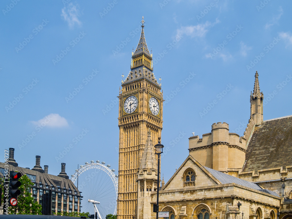 London Eye ferris wheel behind Westminster Tower