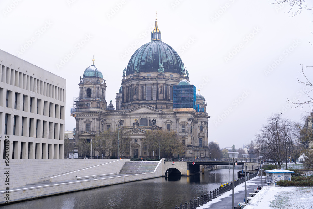 Snow on the Berlin Cathedral with the river and the bridge, Germany