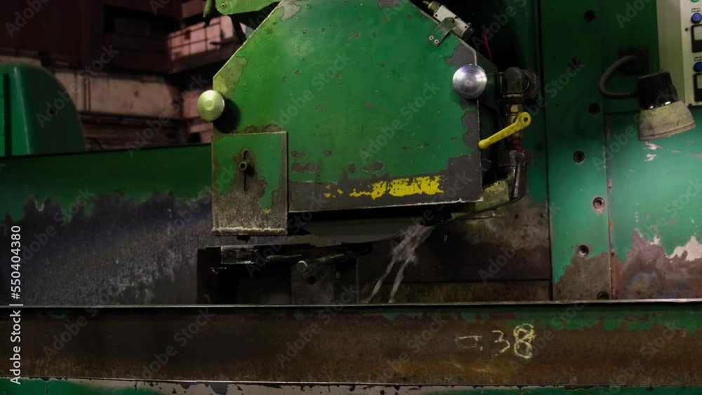 caucasian young strong blacksmith working with open fire in furnace. The blacksmith forging hot iron workshop.Red hot steel metal billets after molten steel casting. Continuous casting machine caucasian young strong blacksmith working with open fire in furnace. The blacksmith forging hot iron workshop.Red hot steel metal billets after molten steel casting. Continuous casting machine