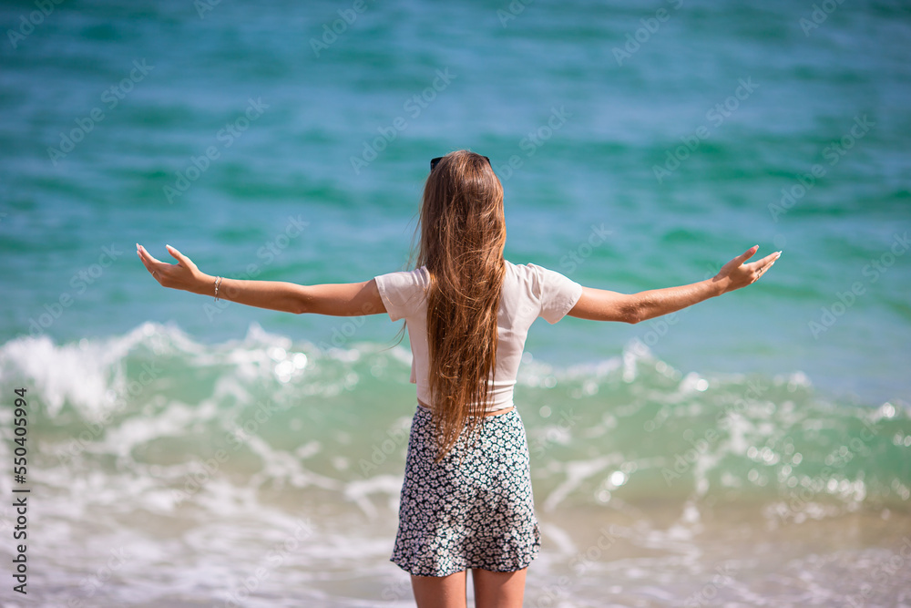 Happy young girl enjoy tropical beach vacation Happy young girl enjoy tropical beach vacation