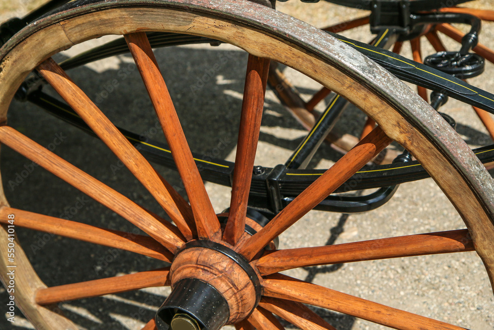 The detail of the wooden wheel of the old coach. 
