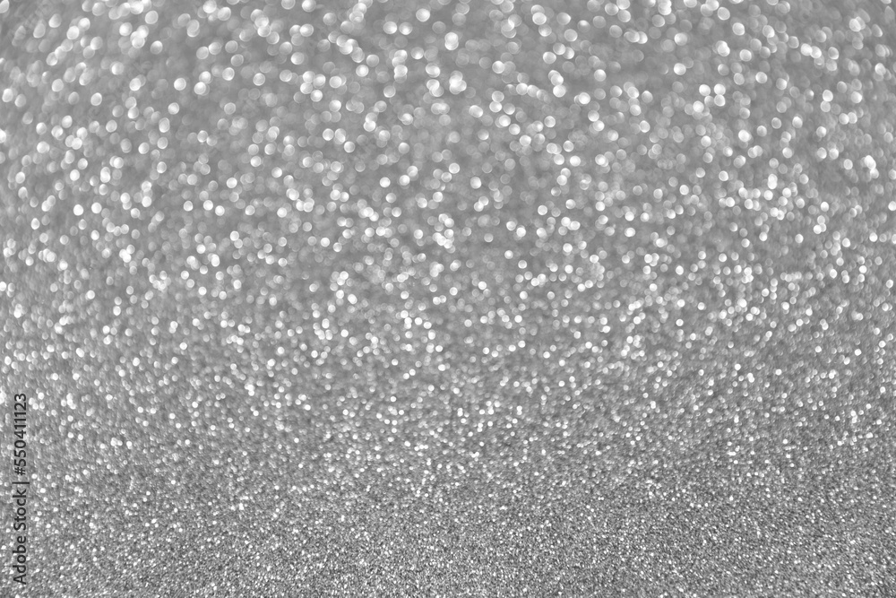Abstract festive bokeh background. Glitter sparkling silver texture