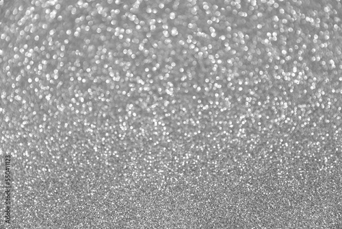 Abstract festive bokeh background. Glitter sparkling silver texture