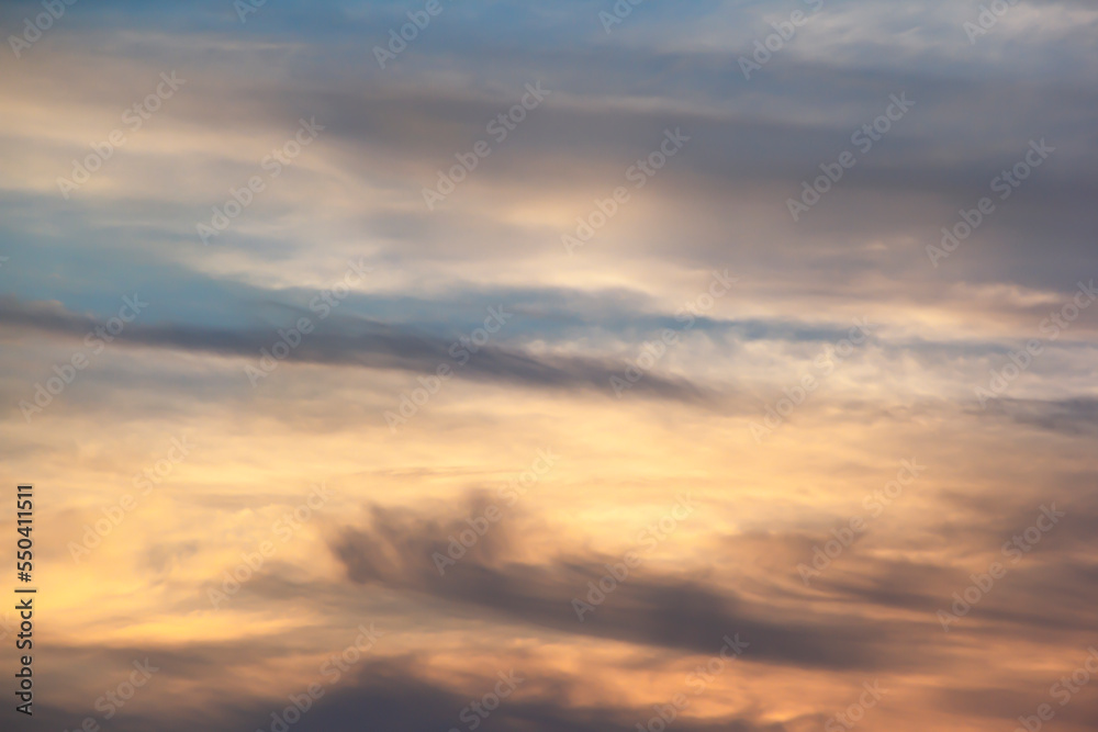 Soft lines of clouds in the sky at sunset