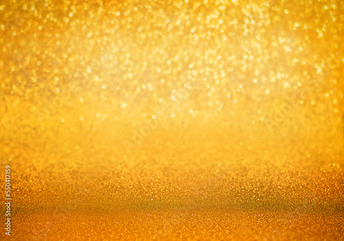 Golden luxurious unfocused background, glitter golden lights.