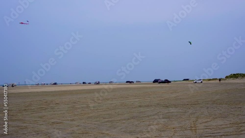 Beautiful shot of kite flying above a rural field in Romo, Bilstrand, Denmark photo