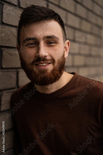 Young handsome man with a red beard, portrait, close-up. © Yuliya Kirayonak