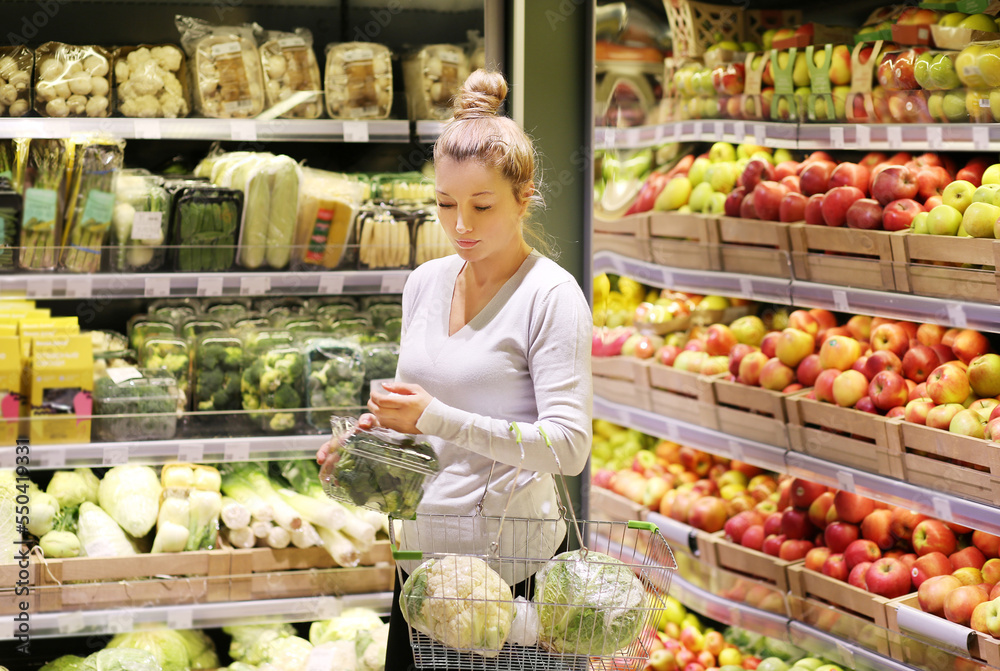 Woman buying fruits and vegetables at the market