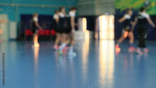 A group of young multiethnic sportswomen in sportswear playing basketball during training. blurred focus. Great for TV news.