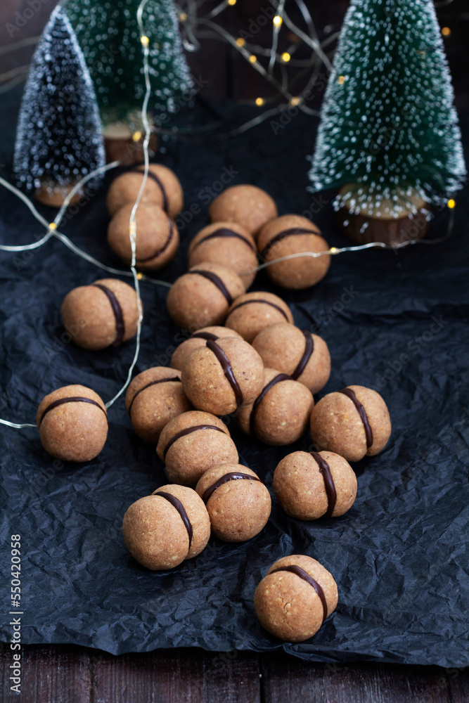 Lady's kisses, traditional Italian nut cookies with coffee and chocolate filling.