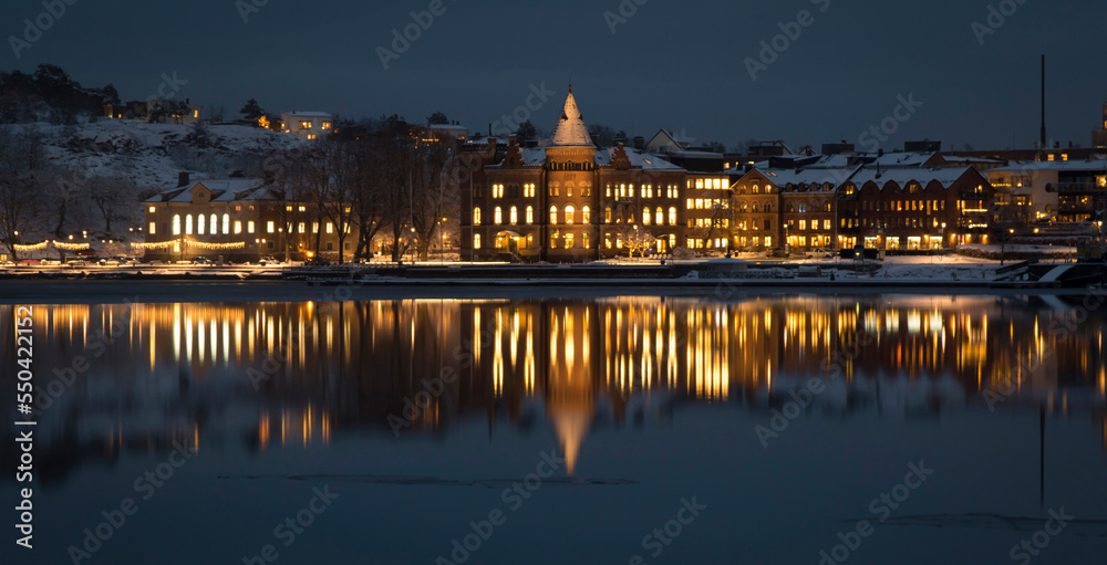 View of the city and an embankment winter evening