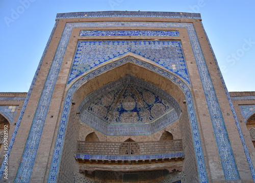 Close-up Madrassah of Ala-Kuli Khan in oriental style and ornment in the old city of Khiva (Xiva) in Uzbekistan photo