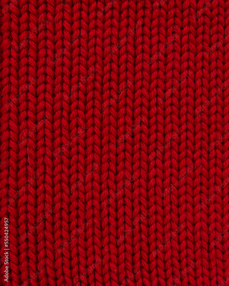 Woolen red knitted warm texture fabric background