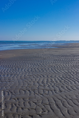 Beautiful seascape. Low tide in Porto Caleri  Rosolina  Italy. Vertical image.