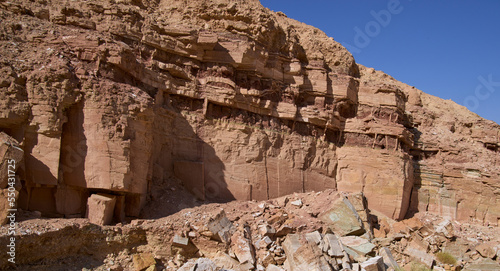 Pattern on rock walls of a dry canyon in a remote region of Negev desert near kibbutz Yotvata. Impressive high vertical sandstone walls of a canyon. 