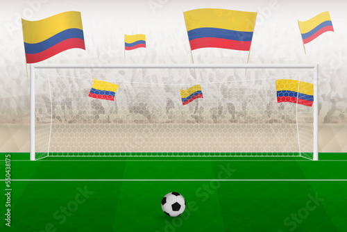 Colombia football team fans with flags of Colombia cheering on stadium, penalty kick concept in a soccer match.