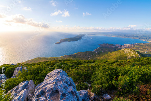 Top view of the iconic and picturesque town of Pylos and of the nearby island Sfaktirias, Messinia prefecture, Peloponnese, Greece photo