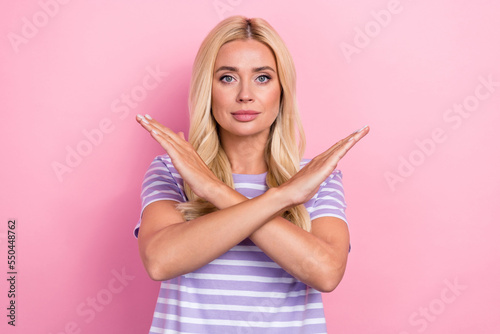 Photo of serious concentrated person crossed arms demonstrate stop enough gesture isolated on pink color background © deagreez