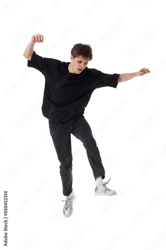 young man in black t-shirt smiling jumping high young man in black t-shirt smiling jumping high