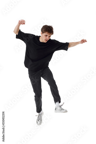 young man in black t-shirt smiling jumping high