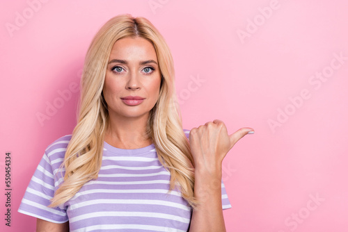 Photo of adorable nice lady thumb arm direct empty space recommend visit beauty salon haircare isolated on pink color background