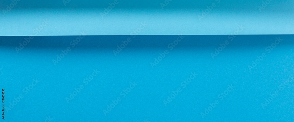 Colorful blue folded paper material design horizontally. Top view, flat lay. Banner