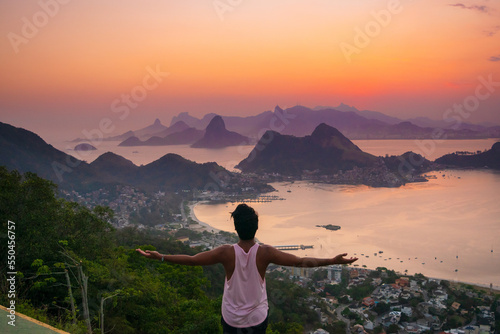 man yoga in the montain with sunset photo