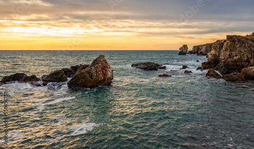 Beautiful cliffs of the Black sea. Rocks among the sea waves.