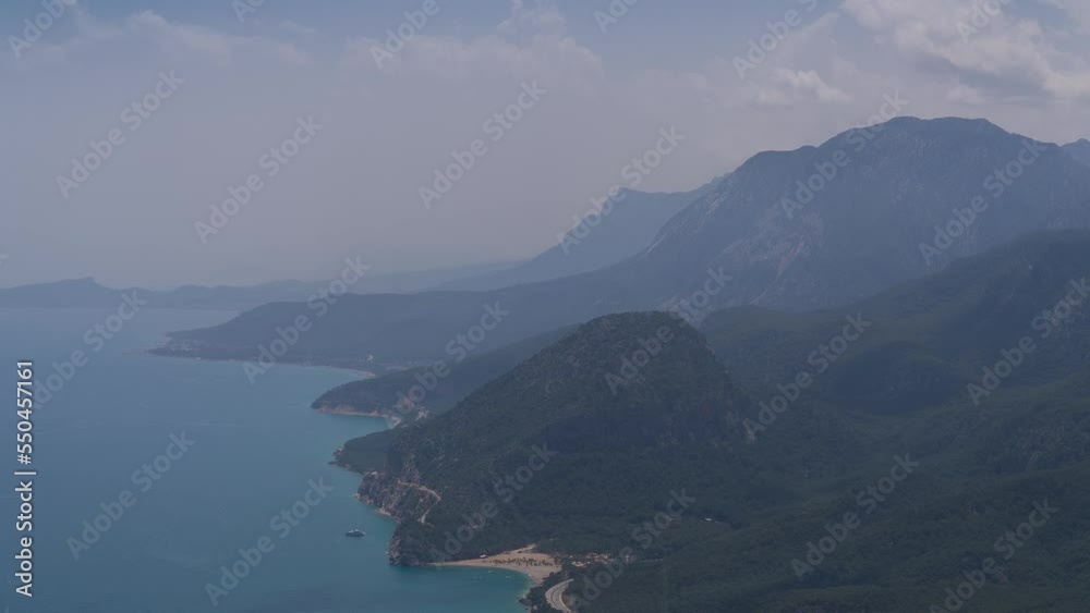 Mountains time-lapse. South of Turkey, Antalya. Mediterranean Sea. Clouds fly over the mountains and scratch the tops of the mountains. The rocky cliffs are partially covered with trees. Mountains time-lapse. South of Turkey, Antalya. Mediterranean Sea. Clouds fly over the mountains and scratch the tops of the mountains. The rocky cliffs are partially covered with trees.
