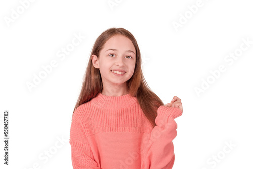 Girl 11 years old in a pink sweater isolated on white. Portrait of a teenage girl.