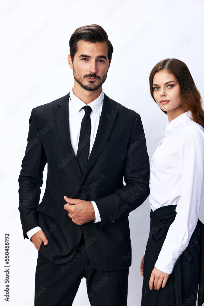Man and woman smile with teeth business in business attire looking into camera on white isolated background. Stylish business concept paired between employees startup copy space