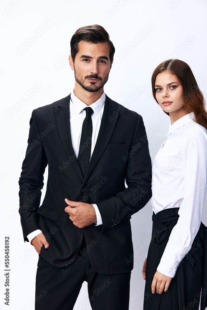 Man and woman smile with teeth business in business attire looking into camera on white isolated background. Stylish business concept paired between employees startup copy space Man and woman smile with teeth business in business attire looking into camera on white isolated background. Stylish business concept paired between employees startup copy space