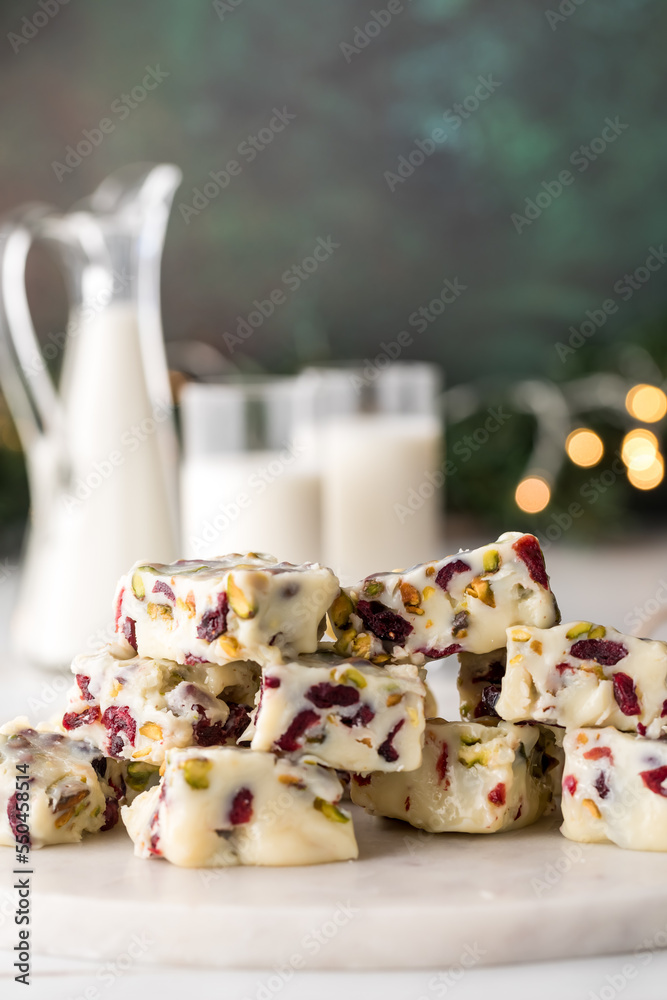 White chocolate cranberry and pistachio fudge served with milk.