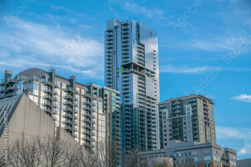 Austin Texas apartments or condominiums towering against blue sky with clouds