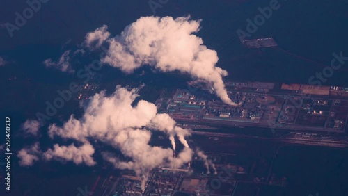 A huge factory, metallurgical complex with smoking pipes. View from plane. - Property of state, billions for owners, jobs, but... destruction of environment in which everyone lives photo