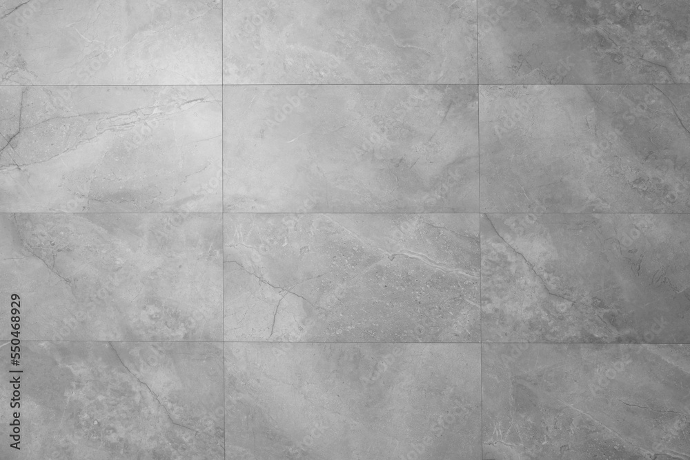 Naklejka premium Beautiful light grey tiled wall as background, closeup
