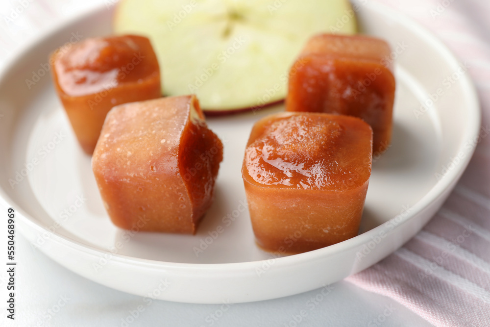 Frozen apple puree cubes with ingredient on table, closeup Frozen apple puree cubes with ingredient on table, closeup