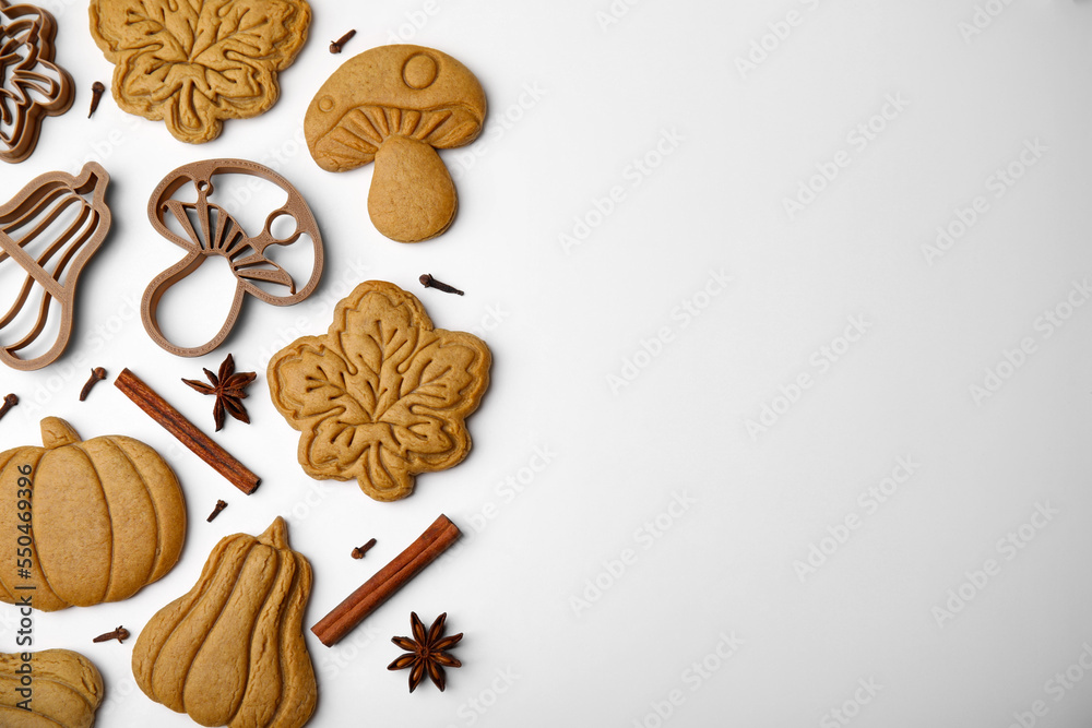 Flat lay composition with tasty cookies, cutters and spices on white table. Space for text Flat lay composition with tasty cookies, cutters and spices on white table. Space for text