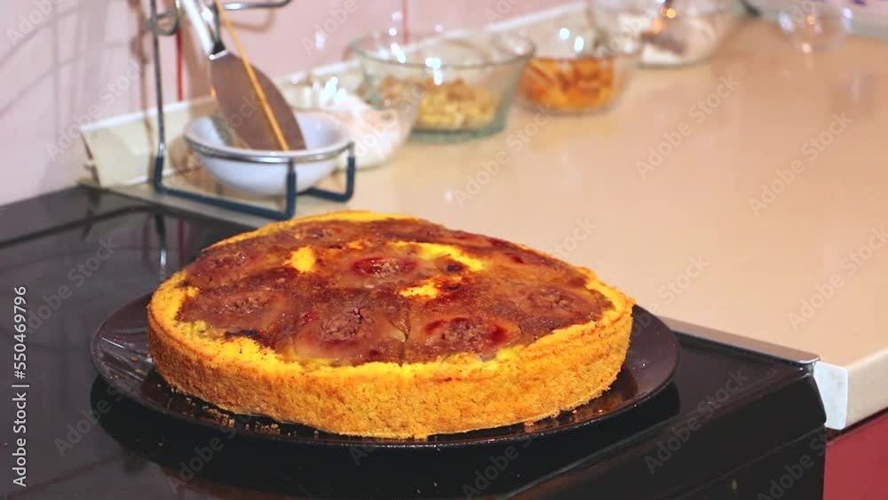 Freshly baked cake with smoke. Baked yellow cake is smoked on the table. A freshly baked cake Freshly baked cake with smoke. Baked yellow cake is smoked on the table. A freshly baked cake