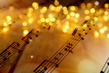 Sheet with music notes as background, closeup. Christmas songs