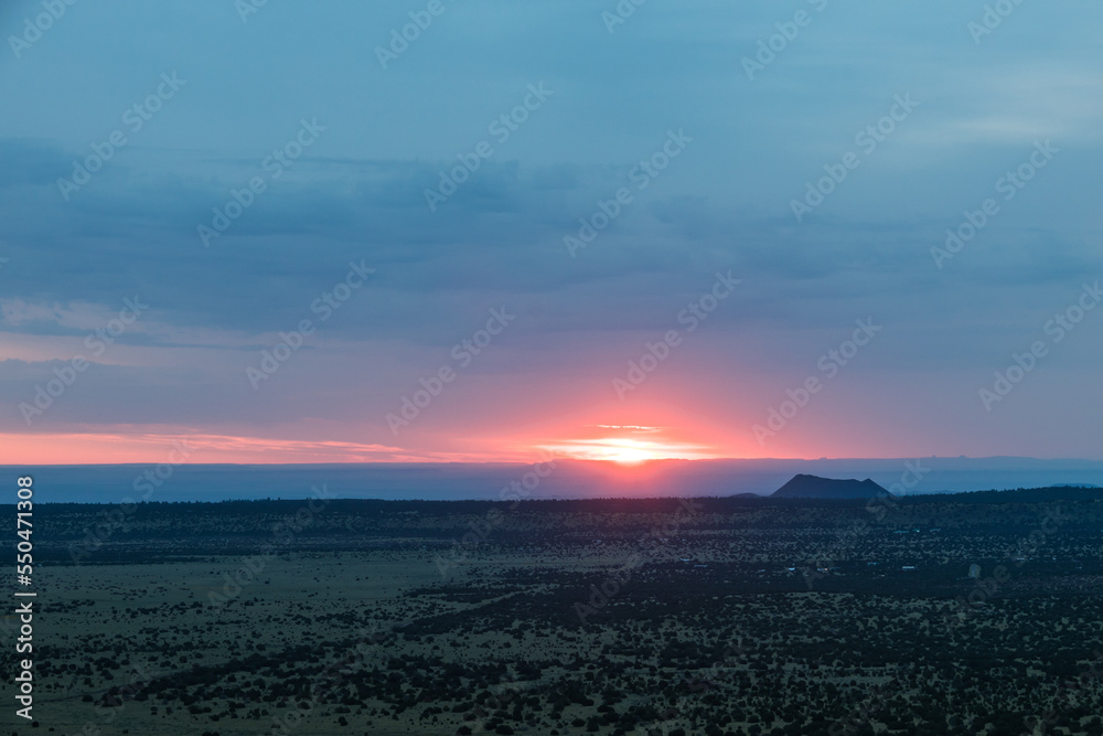 Sunrise over the San Francisco Volcano field in Arizona on a cloudy morning from an elevate position.
