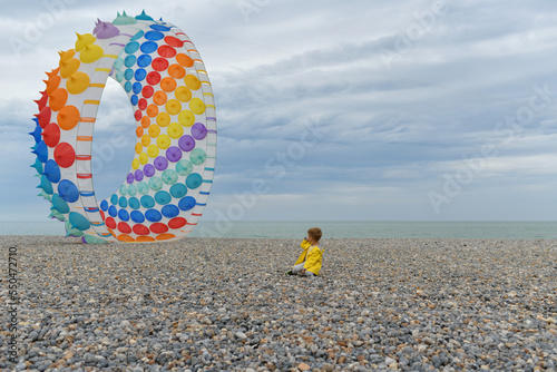 Multicolored air kite in the sky in Atlantic ocean