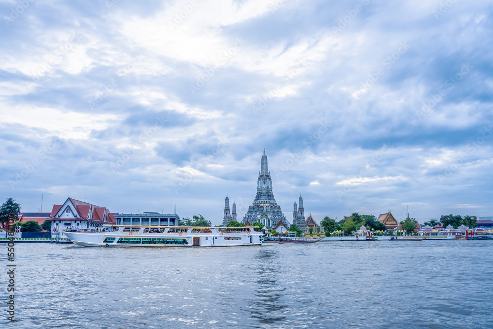 landscape scenery of wat arun pagoda on Chao Phraya river bank
