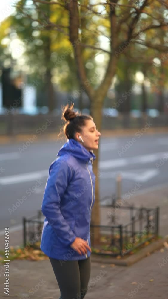 Close-up of an sports women warming up legs before jogging Close-up of an sports women warming up legs before jogging