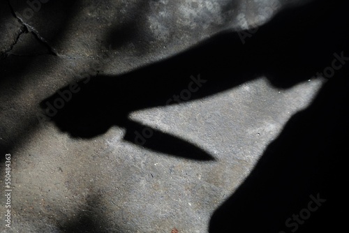 Silhouette of sad male holding knife. concept of killing