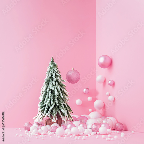 Creative Abstract Festive composition with Christmas design pink pastel color background and Christmas tree. Minimal concept of New Year's and Christmas Holidays. Flat lay.