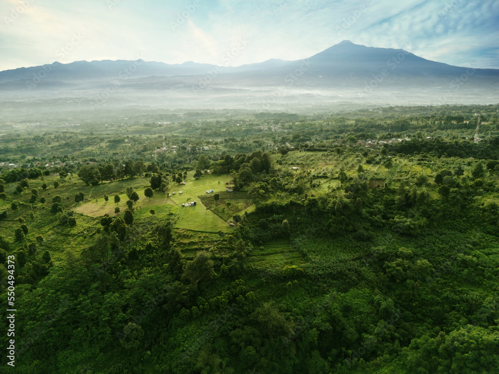 Obraz premium Campsite with misty Pangrango mountain