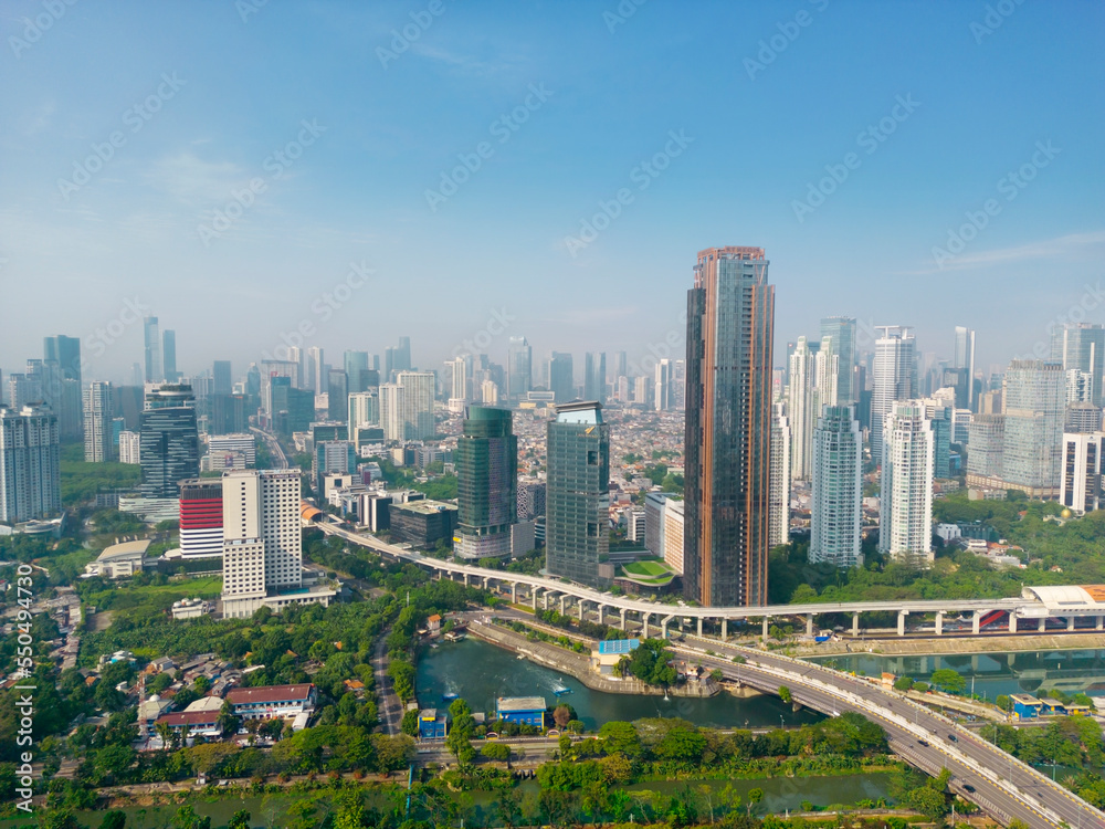 Fototapeta premium Aerial view of Sudirman train station with skyscrapers